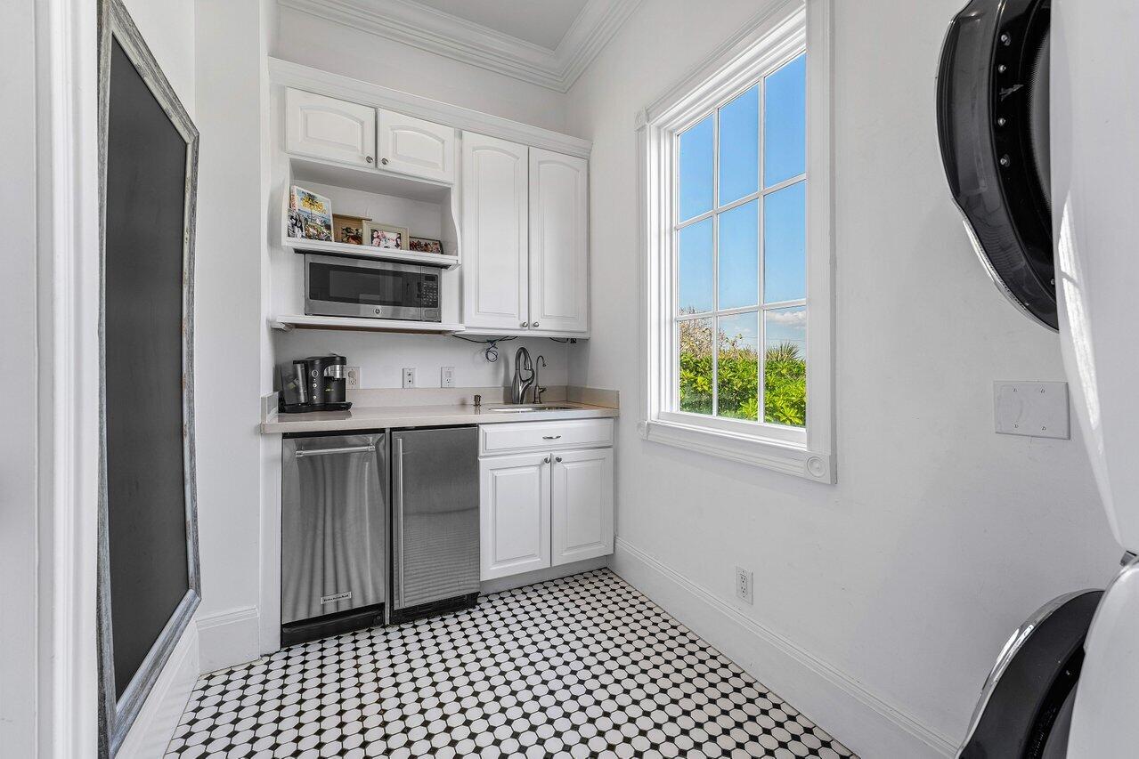 6080 Old Ocean Boulevard Ocean Ridge, FL 33435 - Photo 42 of 50 a kitchen with a sink cabinets and window