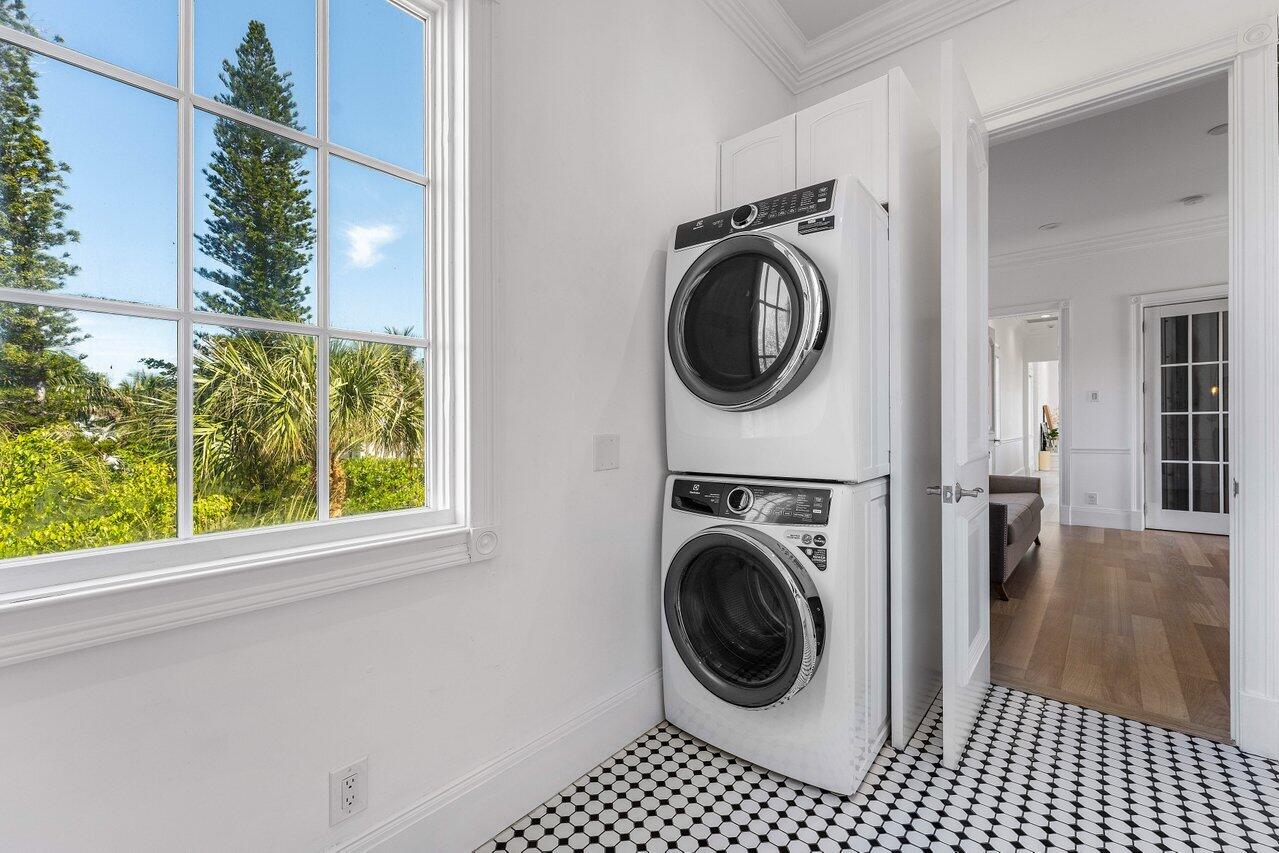 6080 Old Ocean Boulevard Ocean Ridge, FL 33435 - Photo 43 of 50 a view of a hallway with washer and dryer