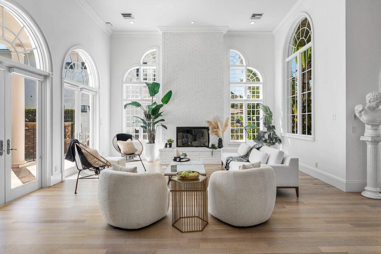 6080 Old Ocean Boulevard Ocean Ridge, FL 33435 - Photo 6 of 50 a living room with furniture a large window and a wooden floor