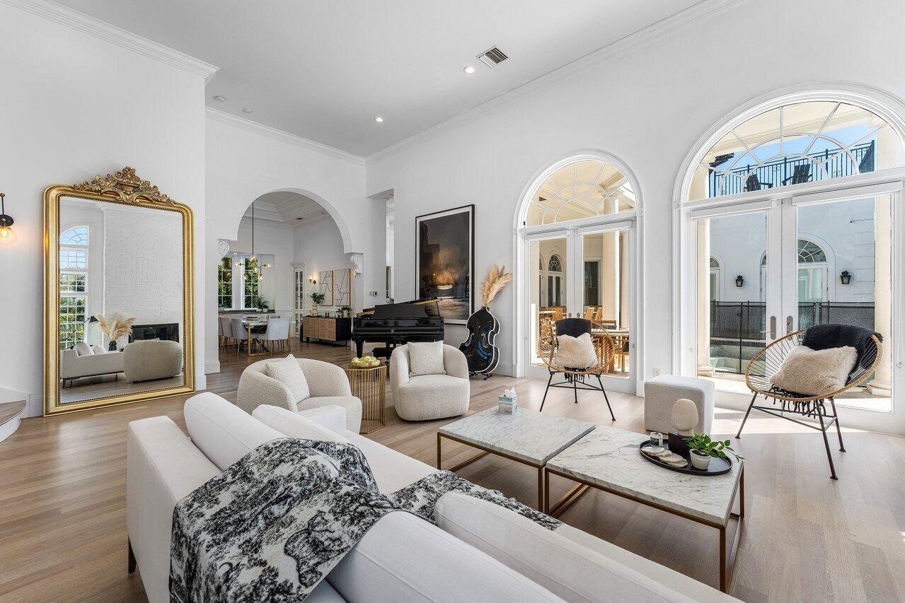 6080 Old Ocean Boulevard Ocean Ridge, FL 33435 - Photo 10 of 50 a living room with furniture and a mirror