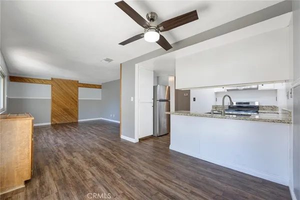 a view of kitchen with dining table and chairs