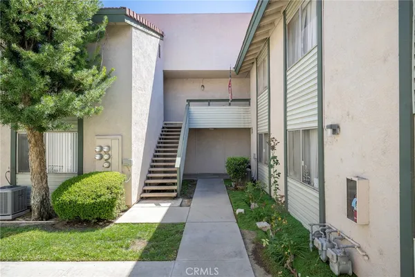 a view of a pathway in front of a house