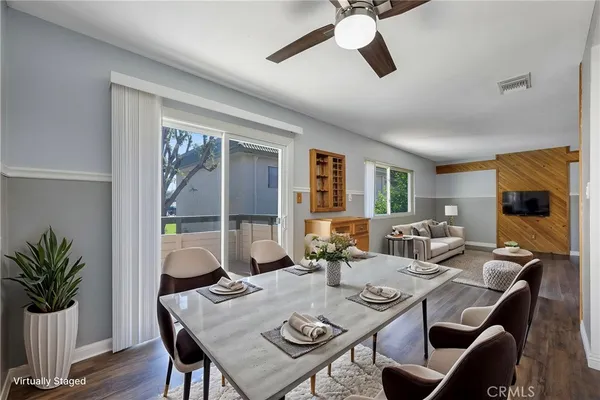 a kitchen with granite countertop a refrigerator and a sink