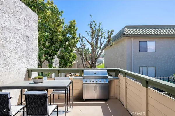 a kitchen with a refrigerator and stove