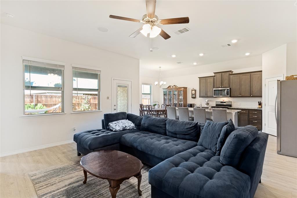 623 Stars Drive Anna, TX 75409 - Photo 7 of 26 The living room is open to the kitchen and dining area!