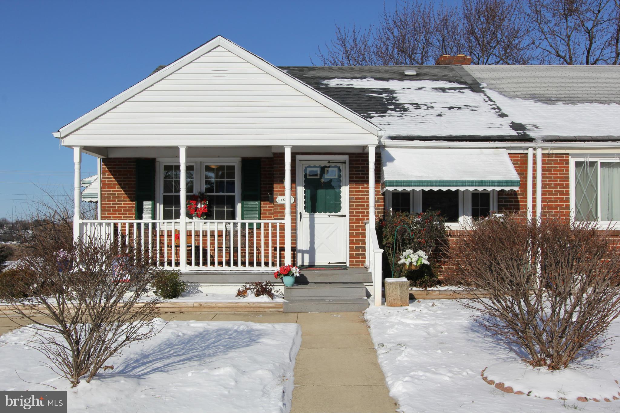 1810 Ellinwood Road Baltimore, MD 21237 - Photo 3 of 30 a front view of a house with a garden