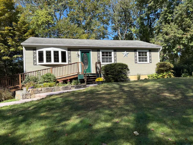 a house that has tree in front of it