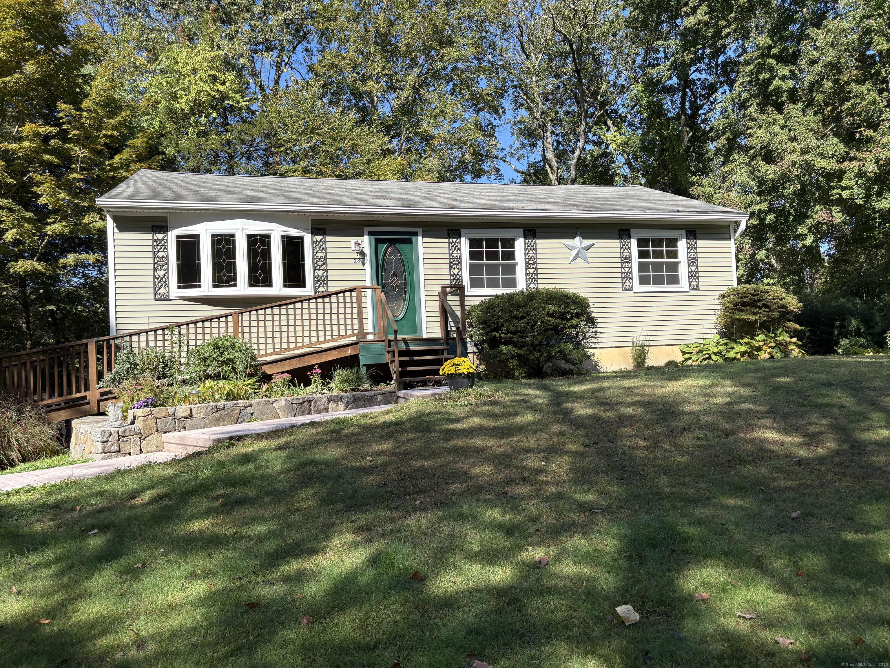 a house that has tree in front of it