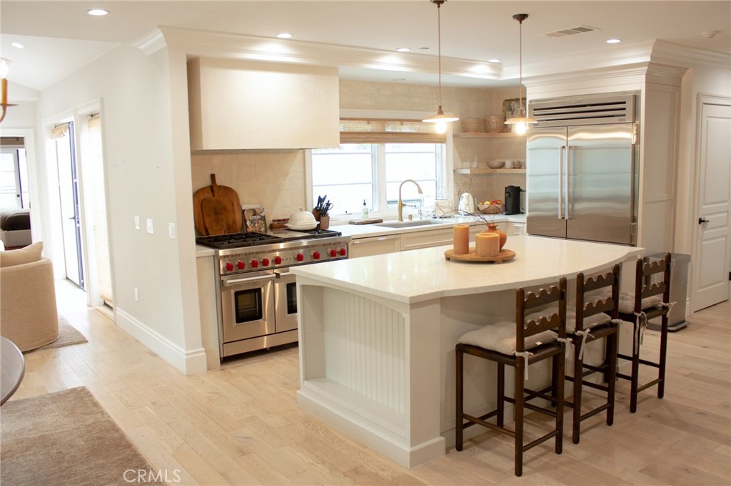 2159 Lorain Road San Marino, CA 91108 - Photo 15 of 48 a kitchen with a stove a refrigerator and a dining table