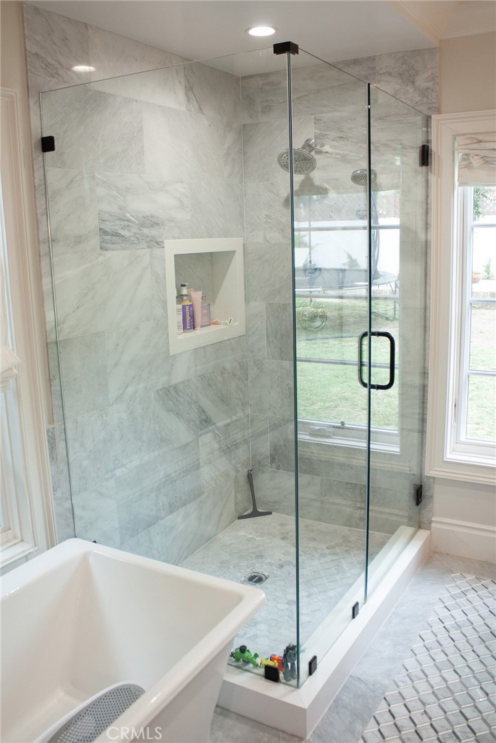 2159 Lorain Road San Marino, CA 91108 - Photo 28 of 48 a bathroom with a bathtub and a shower
