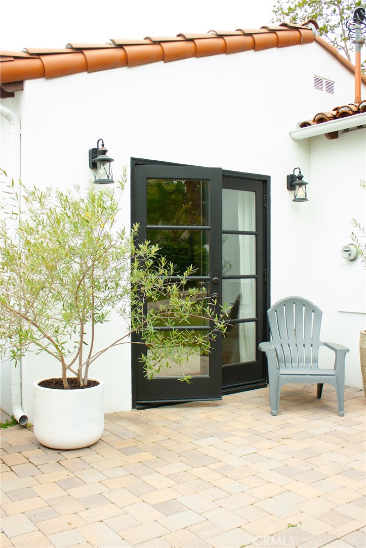 2159 Lorain Road San Marino, CA 91108 - Photo 30 of 48 a view of a potted plant in front of a glass door