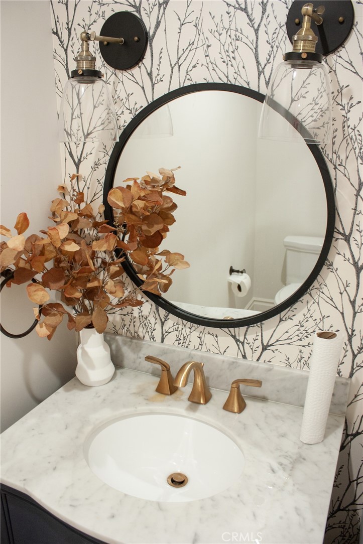 2159 Lorain Road San Marino, CA 91108 - Photo 33 of 48 a bathroom with a sink and mirror