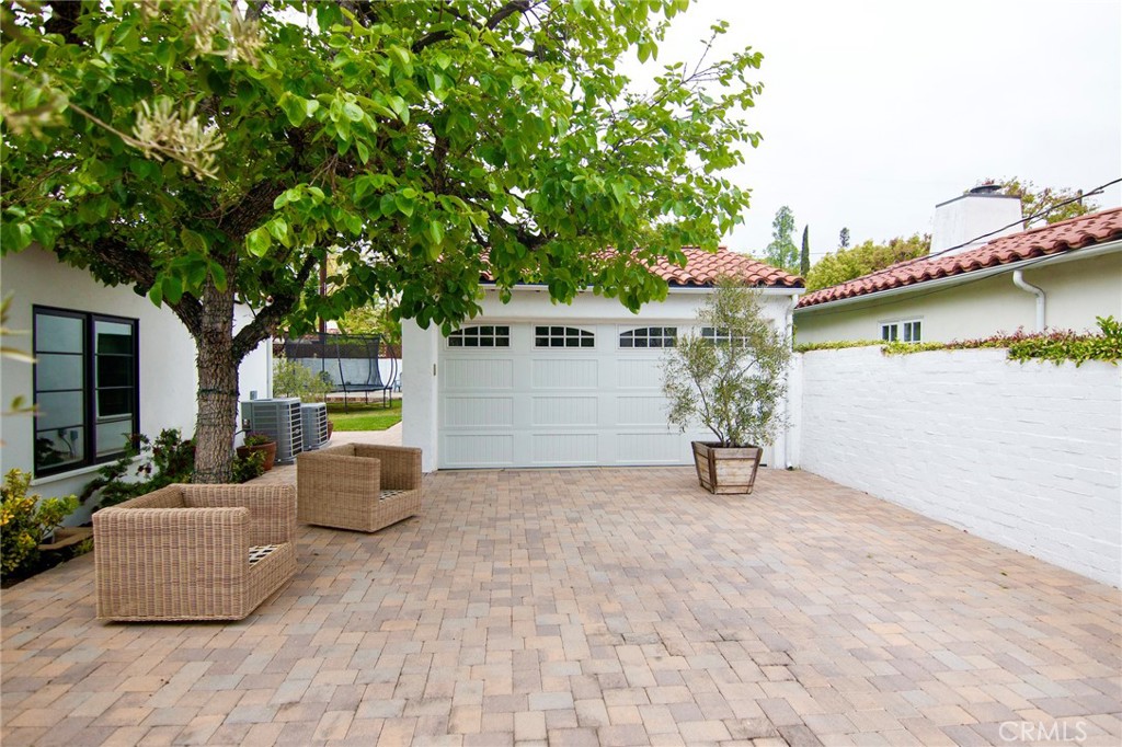 2159 Lorain Road San Marino, CA 91108 - Photo 44 of 48 a view of a patio with table and chairs and potted plants