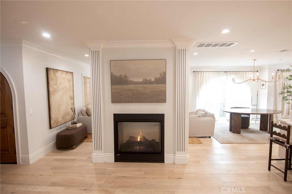 2159 Lorain Road San Marino, CA 91108 - Photo 7 of 48 a living room with furniture a fireplace and a floor to ceiling window
