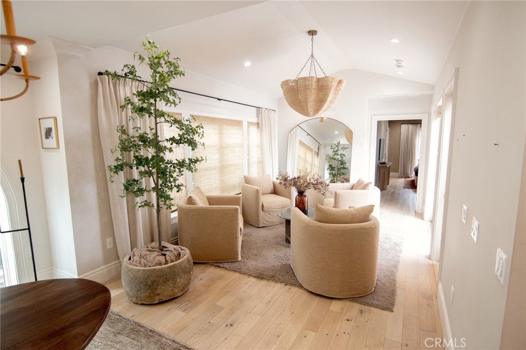 2159 Lorain Road San Marino, CA 91108 - Photo 10 of 48 a living room with a potted plant and a chandelier