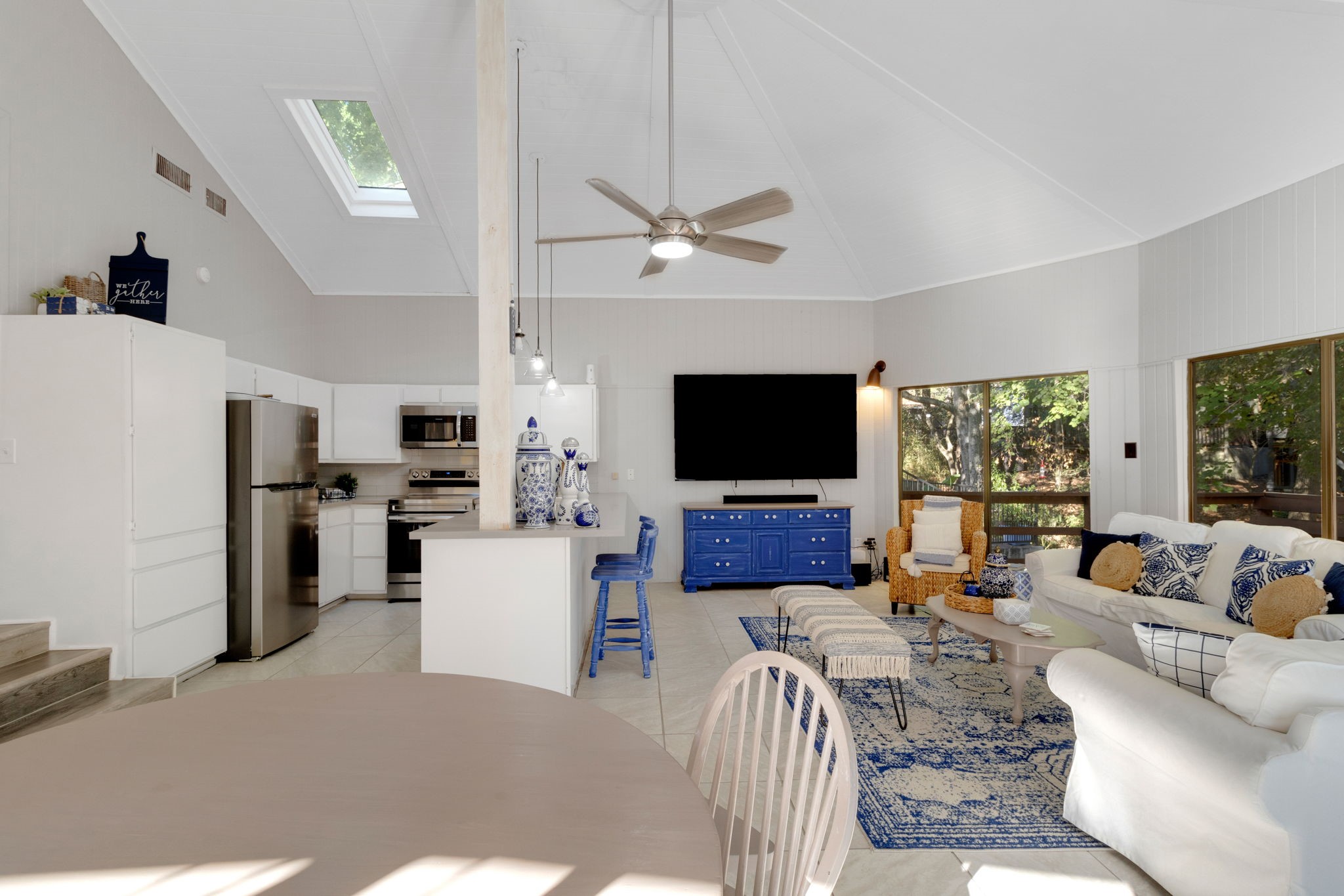 90 Harbour Lane Coldspring, TX 77331 - Photo 4 of 40 Bright living area with vaulted ceiling, skylight, and open connection to the kitchen for easy entertaining.