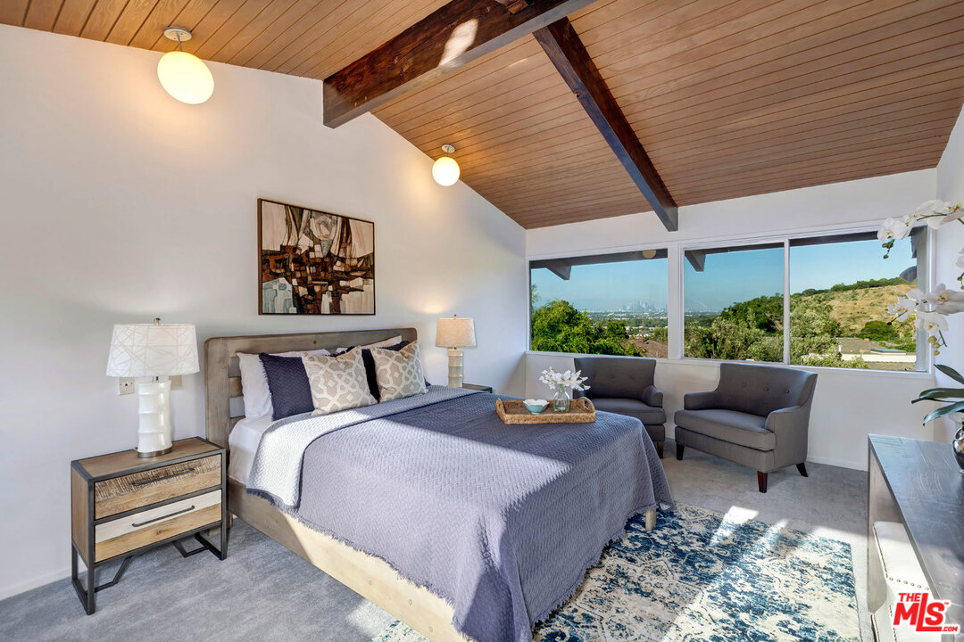 5961 Wrightcrest Drive Culver City, CA 90232 - Photo 22 of 41 a living room with furniture and a large window