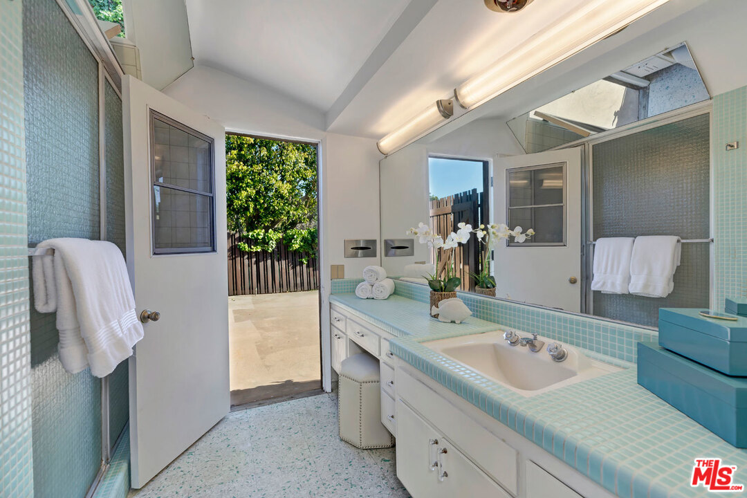 5961 Wrightcrest Drive Culver City, CA 90232 - Photo 24 of 41 a bathroom with a sink and mirror