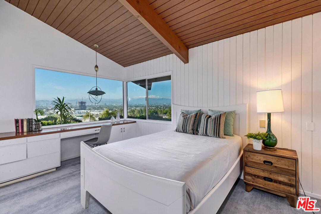 5961 Wrightcrest Drive Culver City, CA 90232 - Photo 25 of 41 a large bed sitting in a kitchen next to a larger window