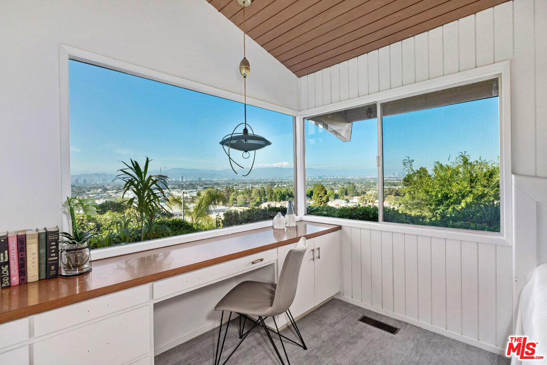 5961 Wrightcrest Drive Culver City, CA 90232 - Photo 26 of 41 a room with a large window and table