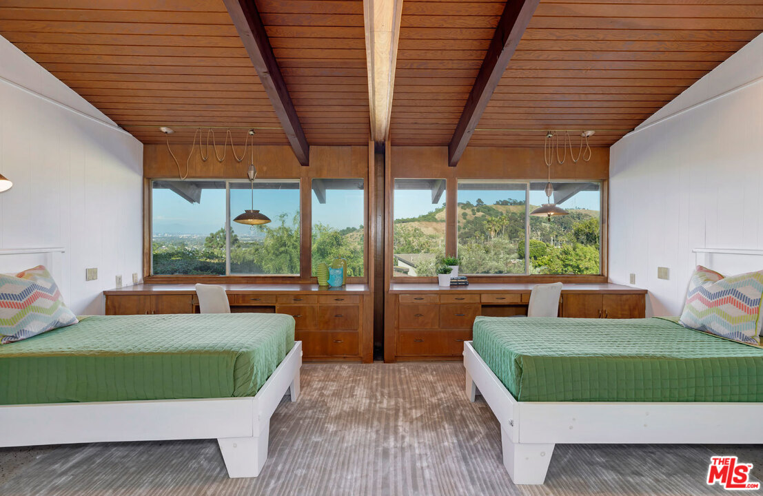 5961 Wrightcrest Drive Culver City, CA 90232 - Photo 28 of 41 a view of a patio with couches chairs and a wooden floor