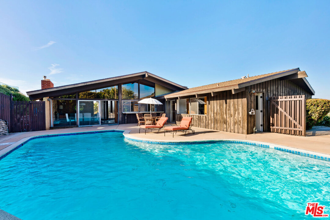 5961 Wrightcrest Drive Culver City, CA 90232 - Photo 33 of 41 a view of a house with swimming pool and porch with furniture