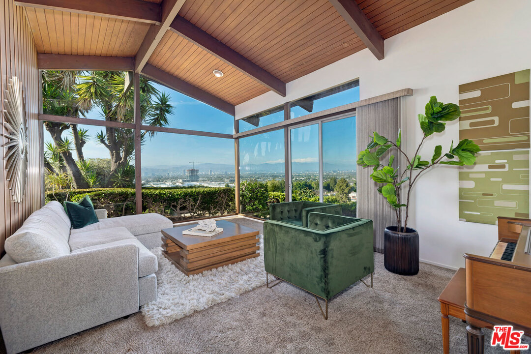 5961 Wrightcrest Drive Culver City, CA 90232 - Photo 8 of 41 a living room filled with furniture and a potted plant