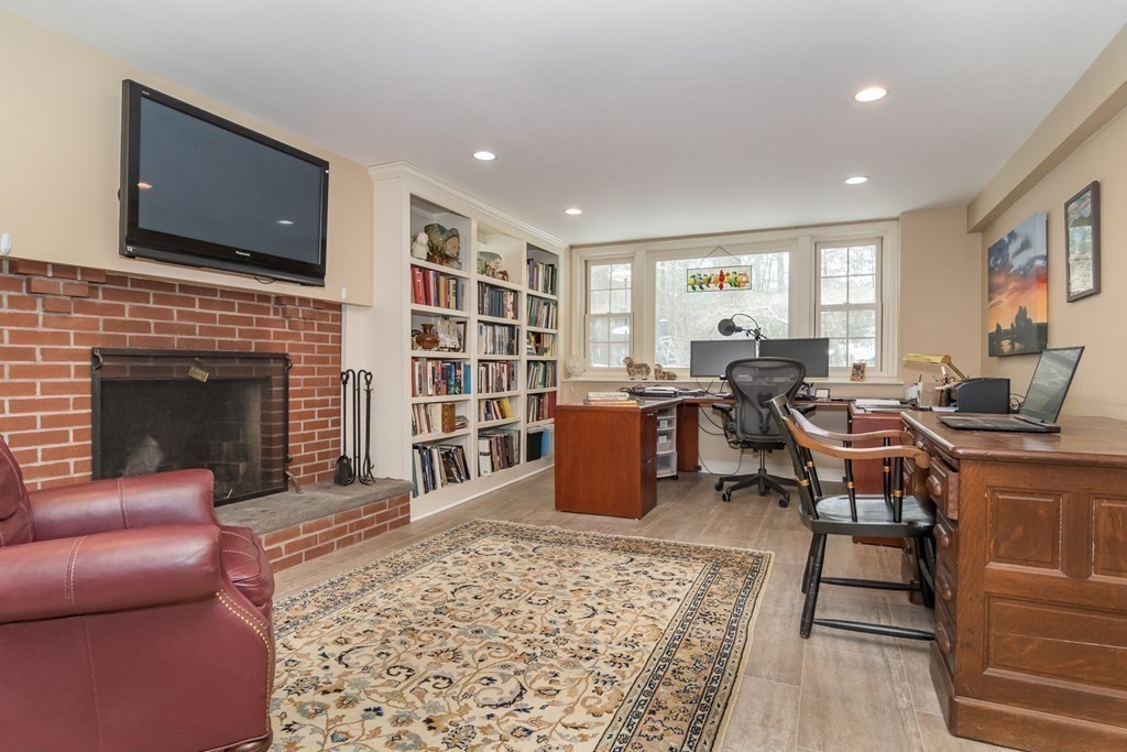 13 Colonial Road Dover, MA 02030 - Photo 16 of 23 a living room with furniture or fireplace and a flat screen tv