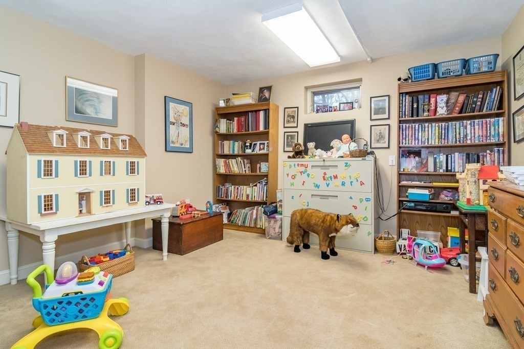 13 Colonial Road Dover, MA 02030 - Photo 17 of 23 a bedroom with furniture toys and a book shelf