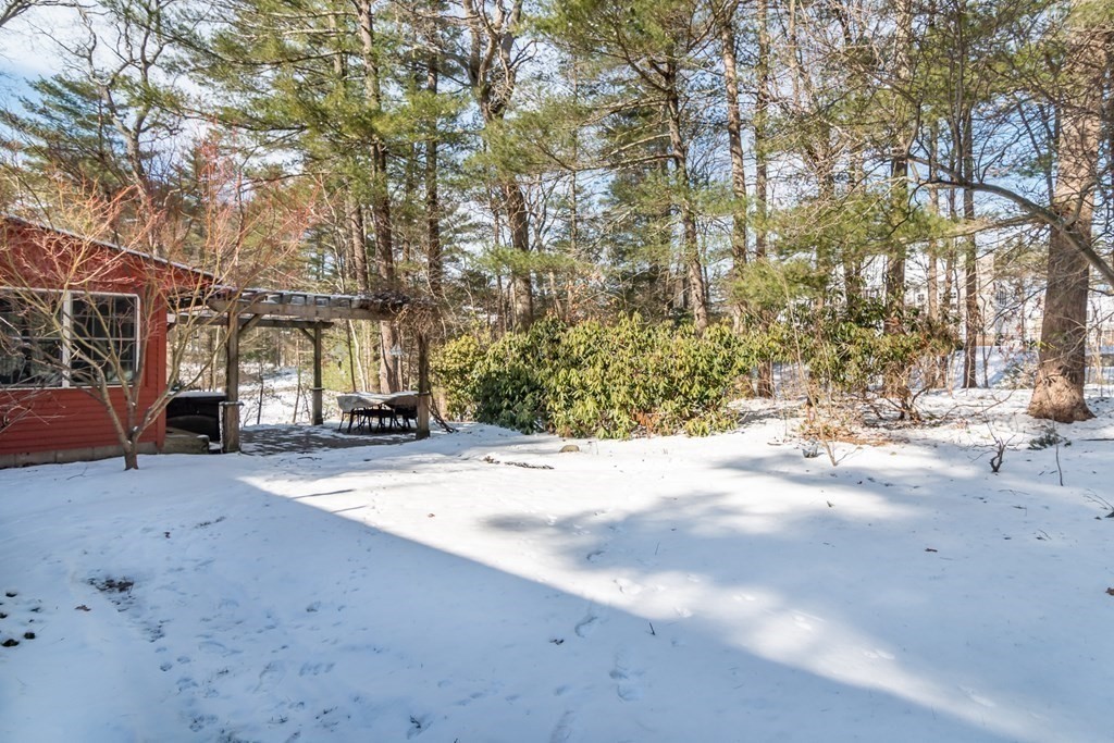 13 Colonial Road Dover, MA 02030 - Photo 18 of 23 a view of a road with a stove