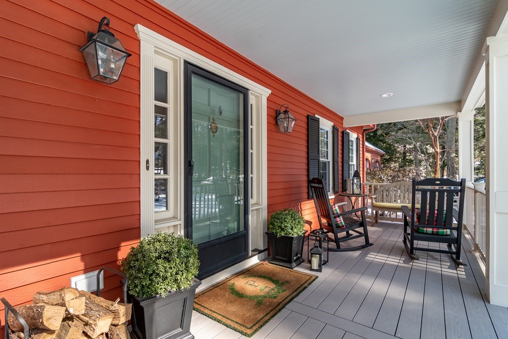 13 Colonial Road Dover, MA 02030 - Photo 2 of 23 a view of balcony with chairs and potted plants