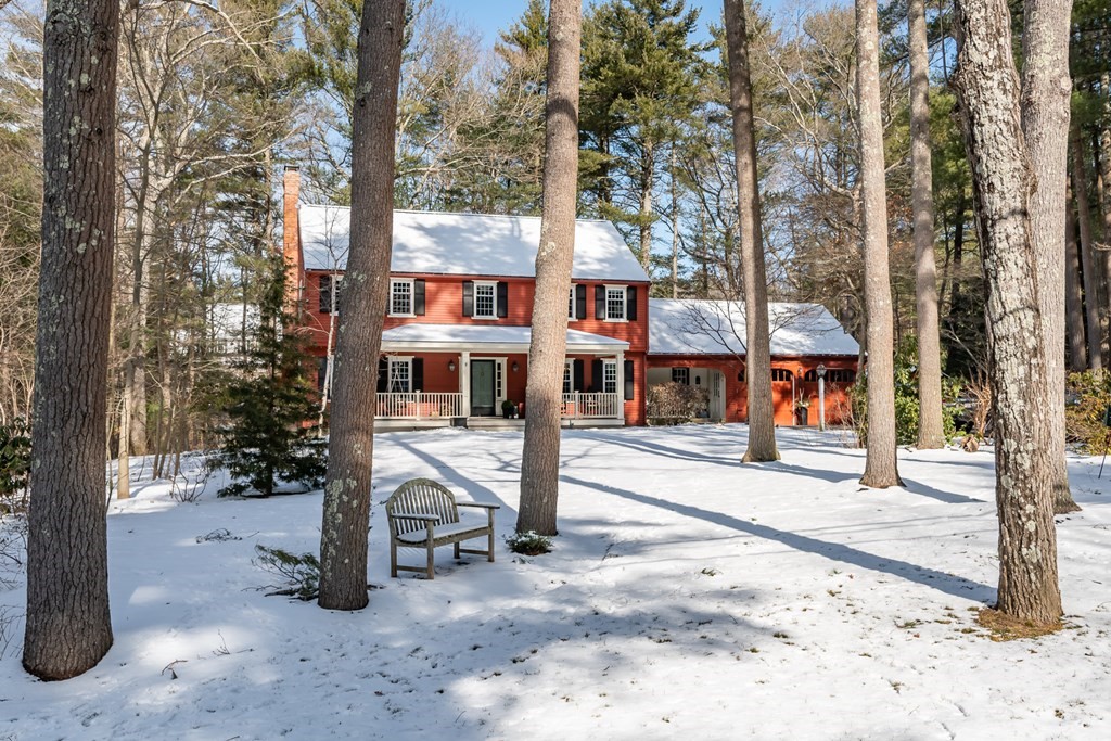 13 Colonial Road Dover, MA 02030 - Photo 22 of 23 a house with trees in front of it