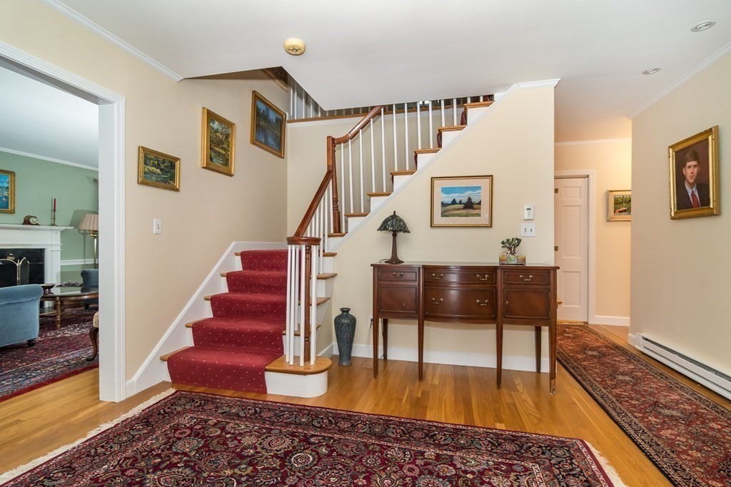 13 Colonial Road Dover, MA 02030 - Photo 3 of 23 a view of entryway and hall with wooden floor