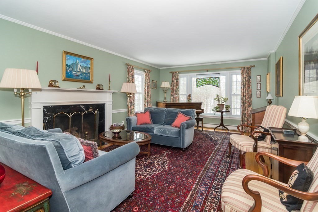 13 Colonial Road Dover, MA 02030 - Photo 4 of 23 a living room with furniture and a fireplace