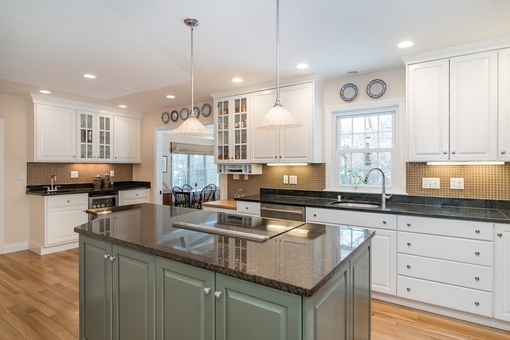 13 Colonial Road Dover, MA 02030 - Photo 6 of 23 a kitchen with stainless steel appliances granite countertop a sink stove and cabinets