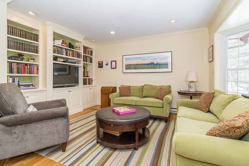 13 Colonial Road Dover, MA 02030 - Photo 9 of 23 a living room with furniture and a flat screen tv