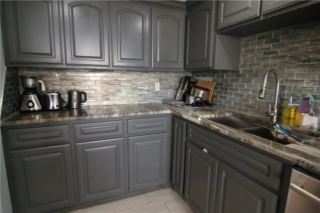 a view of white cabinets with wooden floor