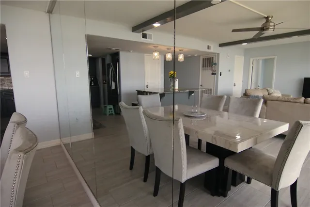 a view of a balcony with floor to ceiling window wooden floor with fence