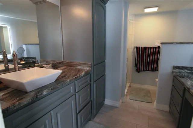 a kitchen with a sink and a stove top oven