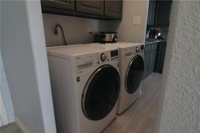 a utility room with furniture and windows