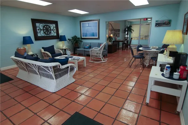 a row of palm trees and swimming pool in the backyard of a house
