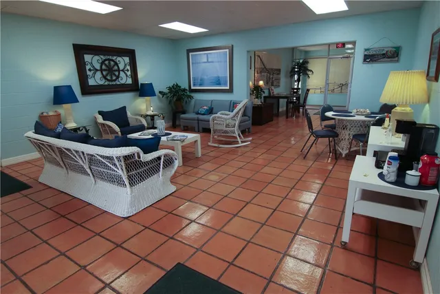 a row of palm trees and swimming pool in the backyard of a house