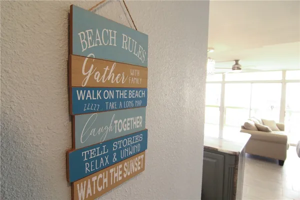 a living room with kitchen island furniture and a large window