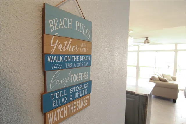 a living room with kitchen island furniture and a large window