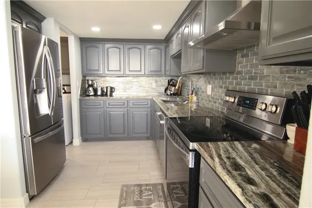 a kitchen with a sink and cabinets