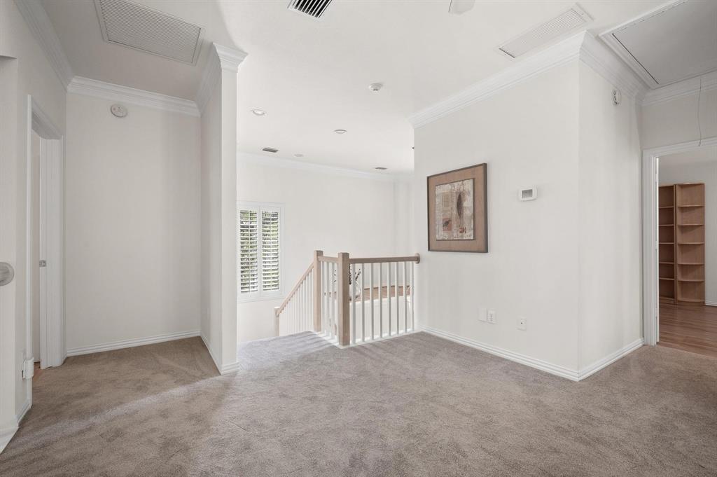 4209 Sexton Lane Dallas, TX 75229 - Photo 24 of 27 a view of a hallway with staircase