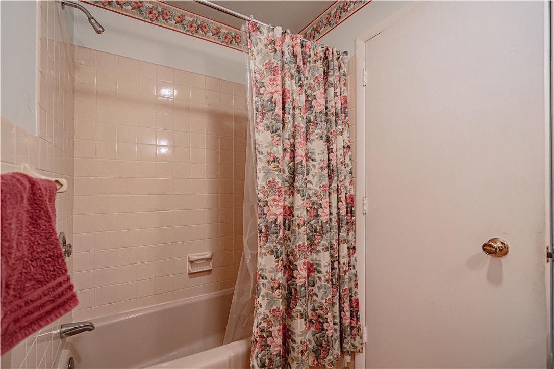 4815 Mill Road Schnecksville, PA 18078 - Photo 25 of 48 A charming, neatly tiled shower with a bathtub, ready for relaxation.