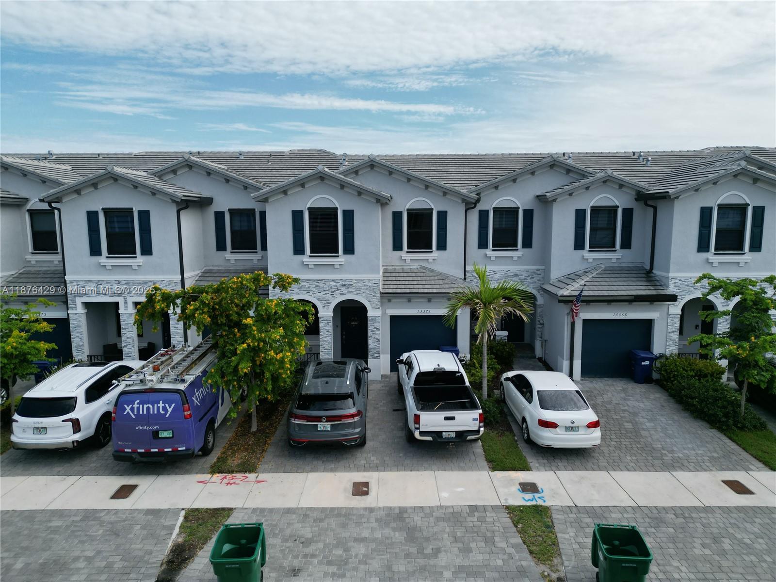 a aerial view of a house with couches and a fireplace