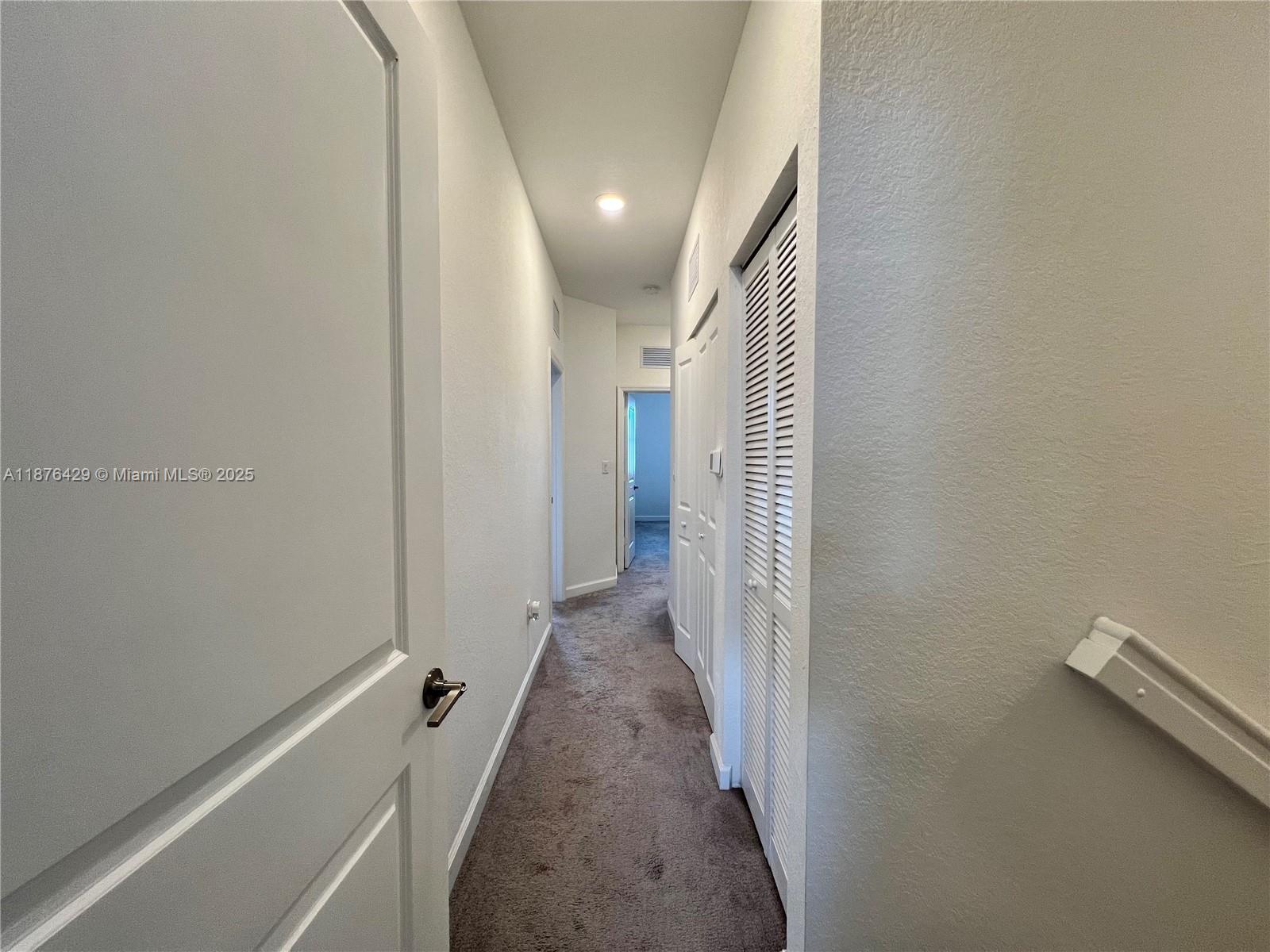13371 Southwest 287th Street Homestead, FL 33033 - Photo 28 of 37 a view of a hallway with wooden floor and staircase