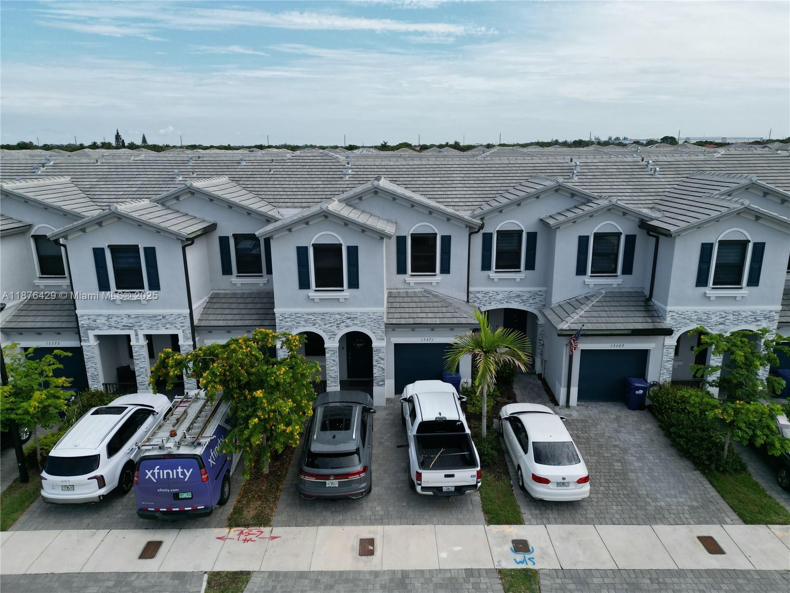 13371 Southwest 287th Street Homestead, FL 33033 - Photo 36 of 37 a view of a car parked in front of a brick house